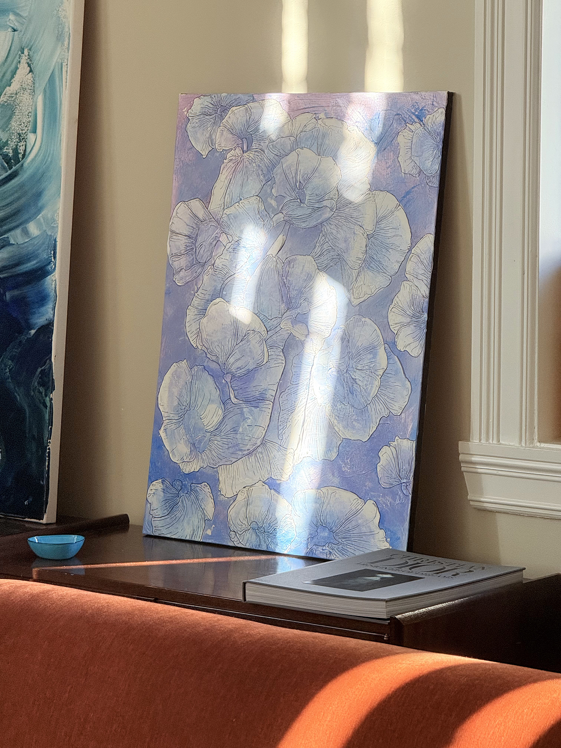 Purple painting with white floral line drawings